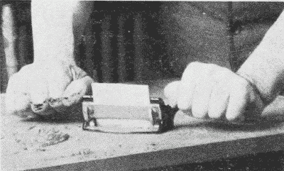 Fig. 151. Using a Veneer-Scraper.