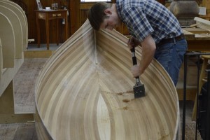 Scraping the inside of the canoe