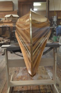 The brass strip on the bow and stern.